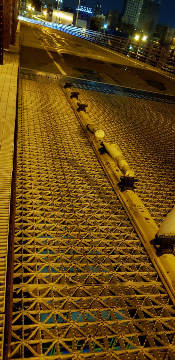 twowheelsg's tweet image. I tried new yellow plastic pads on Roosevelt Island Bridge after the rain -- they are not hideously slippery;
did not try one-handheld cel video while doing skids here.

Bridge ramp pavement is rough but reveals joy of #cobblestone era #pavés.