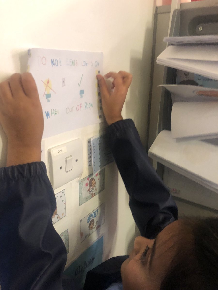 Student council putting up posters they have created to remind everyone to switch off lights 💡🌏🌲<a href="/EnergySparks/">Energy Sparks</a> <a href="/BramleyJunior/">Bramley Sunnyside Junior School</a>