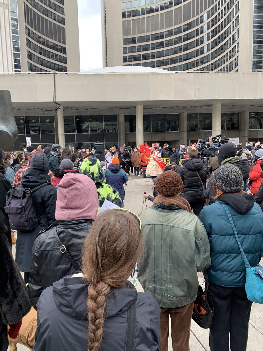 Gathering with activists and community outside City Hall to call for a 50% reduction to the police budget #AnotherTorontoIsPossible