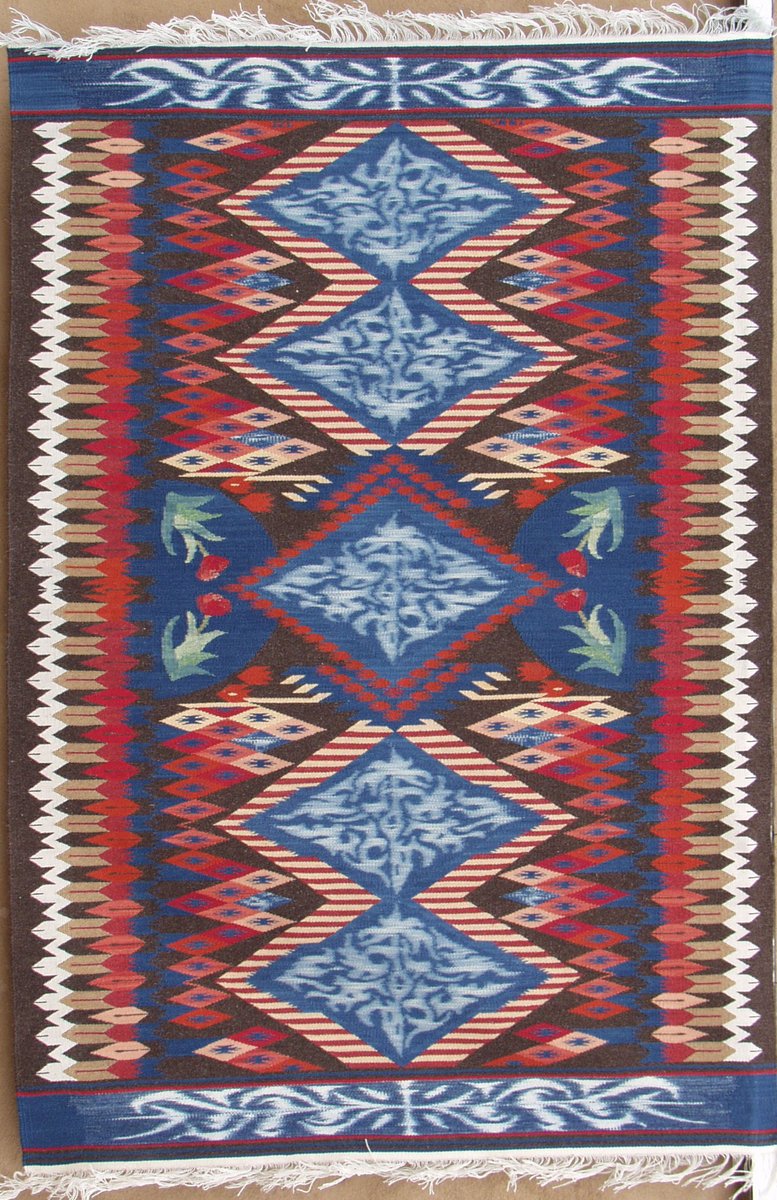 We like to visit some of our best pieces, and this qualifies as one of those. It is called T.A.T.U., and was woven for a customer who wanted to invest in one of Irvin Trujillo's ikat pieces. Ikat is an amazing dyeing technique, combined here with tapestry, a real challenge.