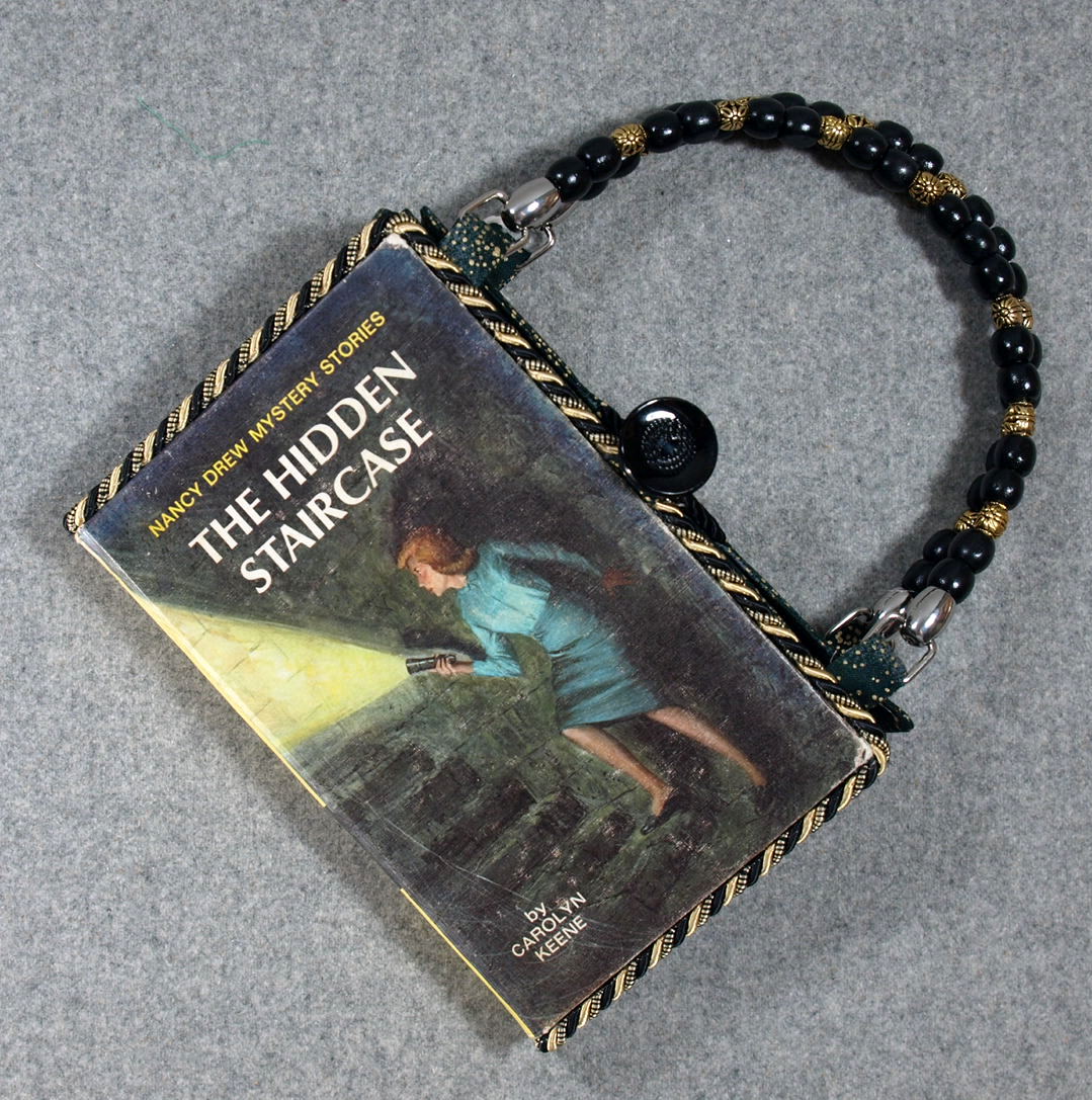 BeeZbyScranton's tweet photo. Well its the start of a new year. So, I've decided to do a "best sellers" list to determine where I should be concentrating. First up, #15 in total sales in 2022 is...ta da...Nancy Drew vintage book purses.  Order your custom Nancy Drew now! https://t.co/3nPrSq7QdZ https://t.co/QNvuWUWaXe
