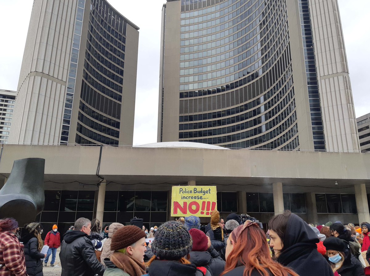 socialist_ca's tweet photo. Toronto rally to defund the police. Mayor Tory is planning to increase the police budget by $50 million while cutting everything from libraries to transit to housing. 
Cops don’t keep people safe - community support does.

#DefundThePolice #toronto #CommunityNotCops #CareNotCops https://t.co/LwbJjr3IJ1