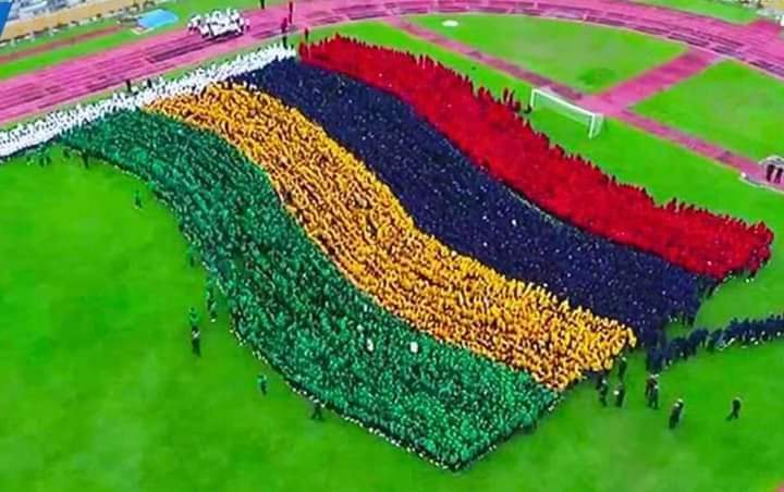 AndAfricas's tweet photo. Thousands of college students massed this Tuesday, January 24, 2023 at the Anjalay Stadium to break the record for the largest human image in the world of a waving national flag. A Guinness World Records representative was also on hand to follow the exercise. https://t.co/auXjdy59v0