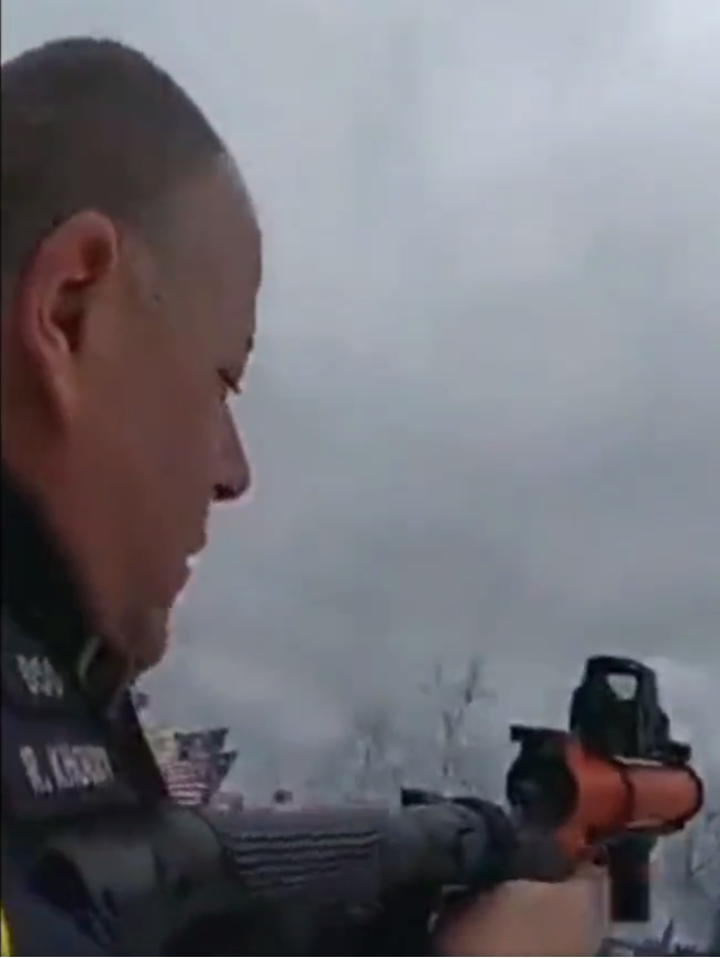 This is a picture of the flunky DC Metro officer that launched a canister of tear gas at the other police gathered on the grounds which led to the ensuing fracas.

I can't make out his name strip???