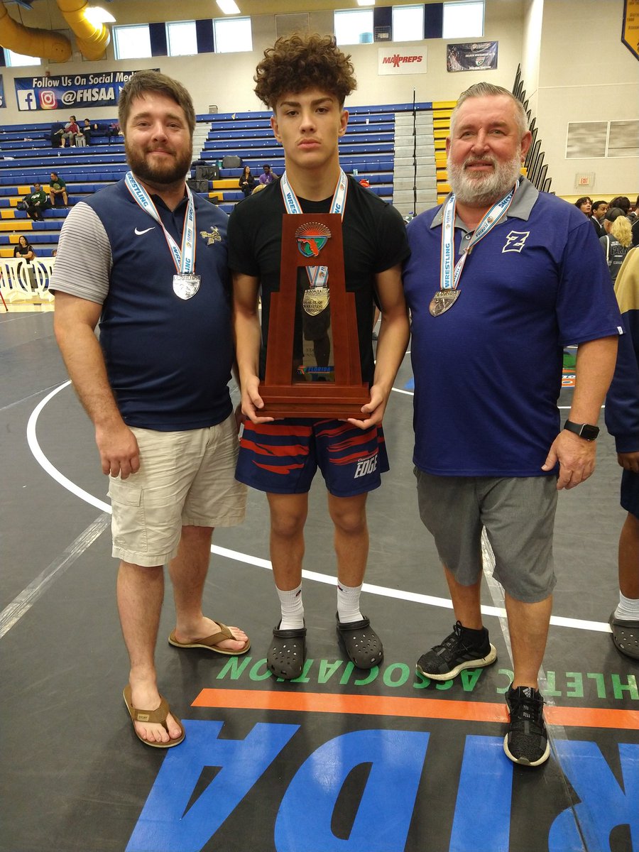 With Head Coach Tim Maple on my right and Niko on the left with our medals and the prestigious Florida State Championship Dual Runner Up Trophy 🏆🥈@wwe @nativetatanka #WEE #WWEUniverse #Wrestling