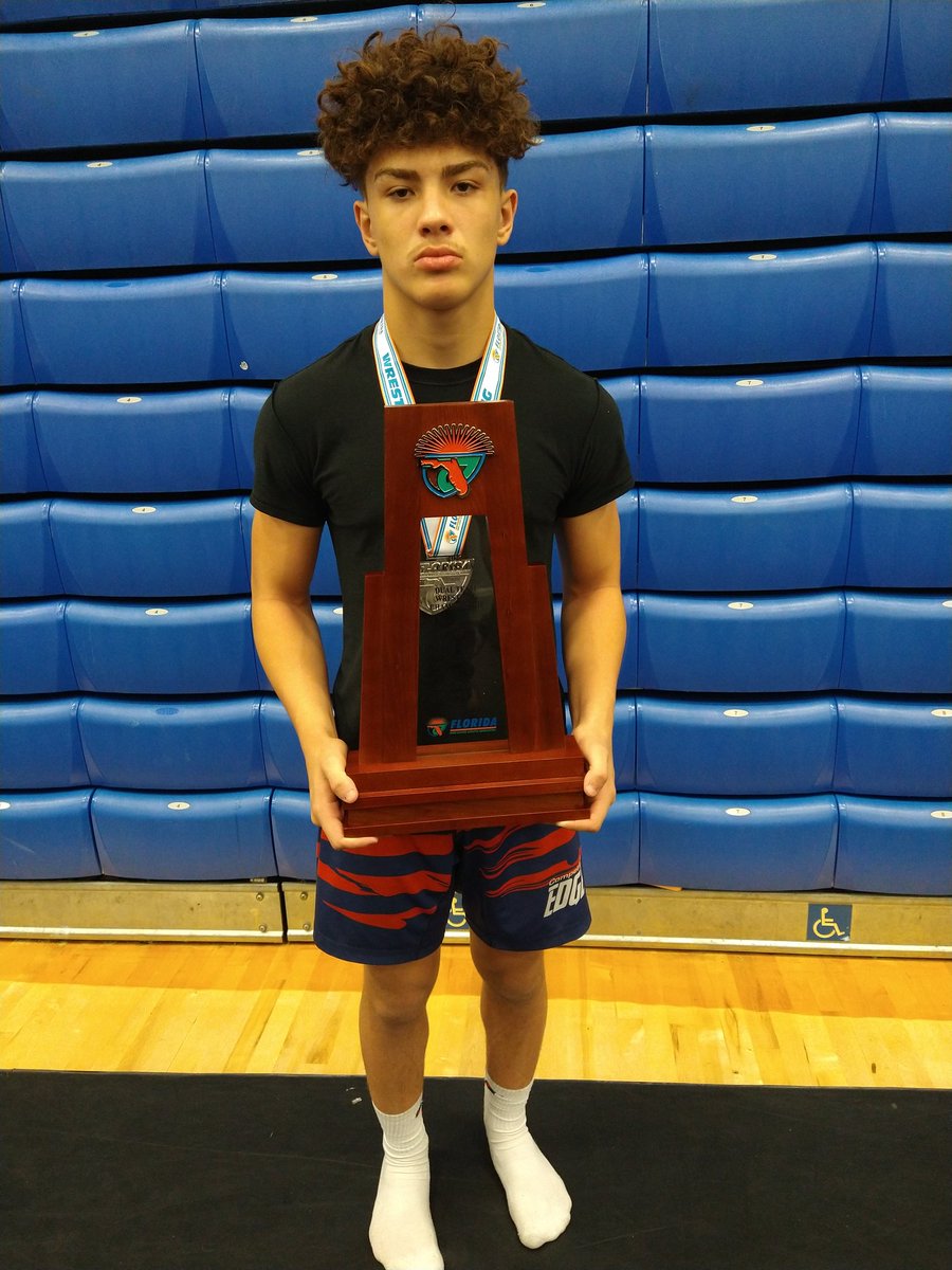 Holding our Florida State Championship Team Dual Runner Up Trophy 🏆👊 💪 @wwe @nativetatanka #WWE #WWEUniverse #Wrestling