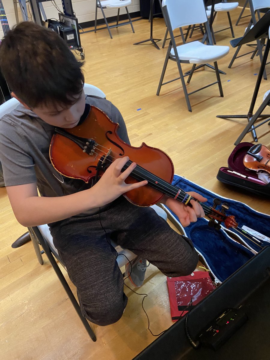 HHoelle's tweet photo. 5th grade orchestra students partnered up to support each other with tuning instruments and playing solo pieces for each other! Student-driven learning in orchestra class! Great job, Falcons! @ayerelementary @FHSchools https://t.co/V3c0M7cG4V
