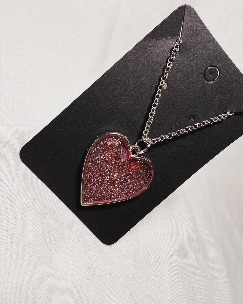 Another item from our Valentine’s Day Collection💐💓💌🌹✨

The “Heartfelt Sparkle” pendent is $25 w/ FREE shipping! 

DM us or place your orders in our ✨NEW&IMPROVED✨ website!💚💜 
#resinjewelry #resinpendant #resinnecklace #handmadejewelry #valentinesday #valetinesdaygift