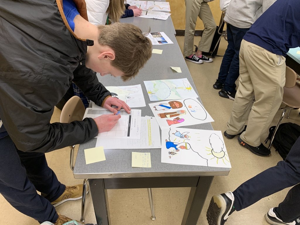 Students in Sr. Catherine Thomas' Who is Jesus Christ course wrapped up their unit on themes within the Gospel of Matthew with final projects, including illustrated Bible passages, mock Instagram posts, and playlists, before sharing their creations with peers in a gallery walk.
