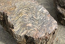 A CALL OUT TO ME??? Episode 169 starts out strong with some geology! So, what is Gneiss? Gneiss is a common metamorphic rock, meaning it is formed when other rocks are subjected to high heat and pressure. This rock gives it's name to gneissic banding, see photos.