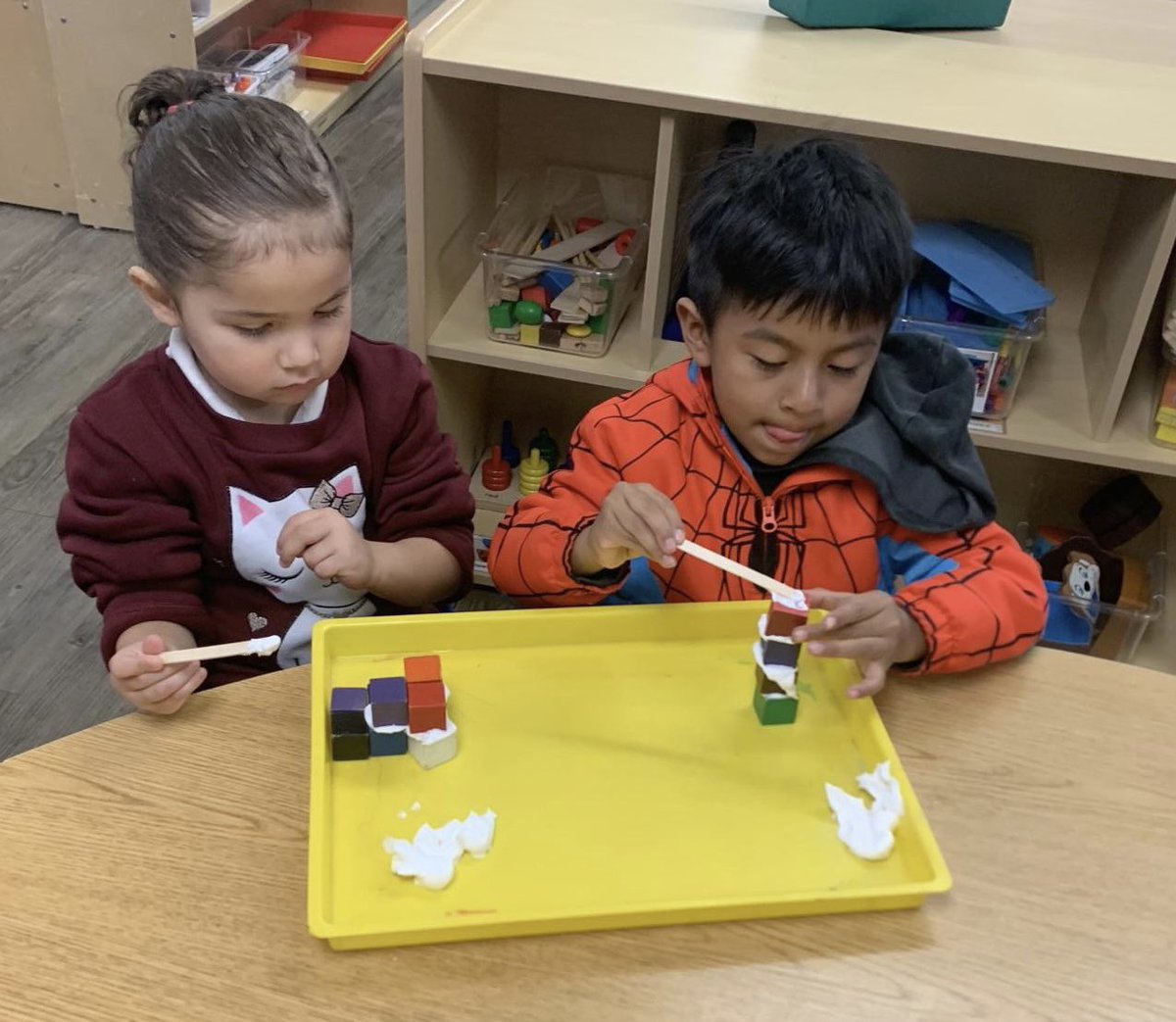 PinewoodEEC's tweet photo. Pinewood EEC students deeply engaged with building towers using shaving cream as “cement”. They counted and compared their towers with their friends. Hands on, minds on. #Buildings #finemotor #spatialskills @ECED4LA @Kelly4LASchools @SteamLdne @MLB4PreK @DeanTagawa https://t.co/JEDEUKgW7R