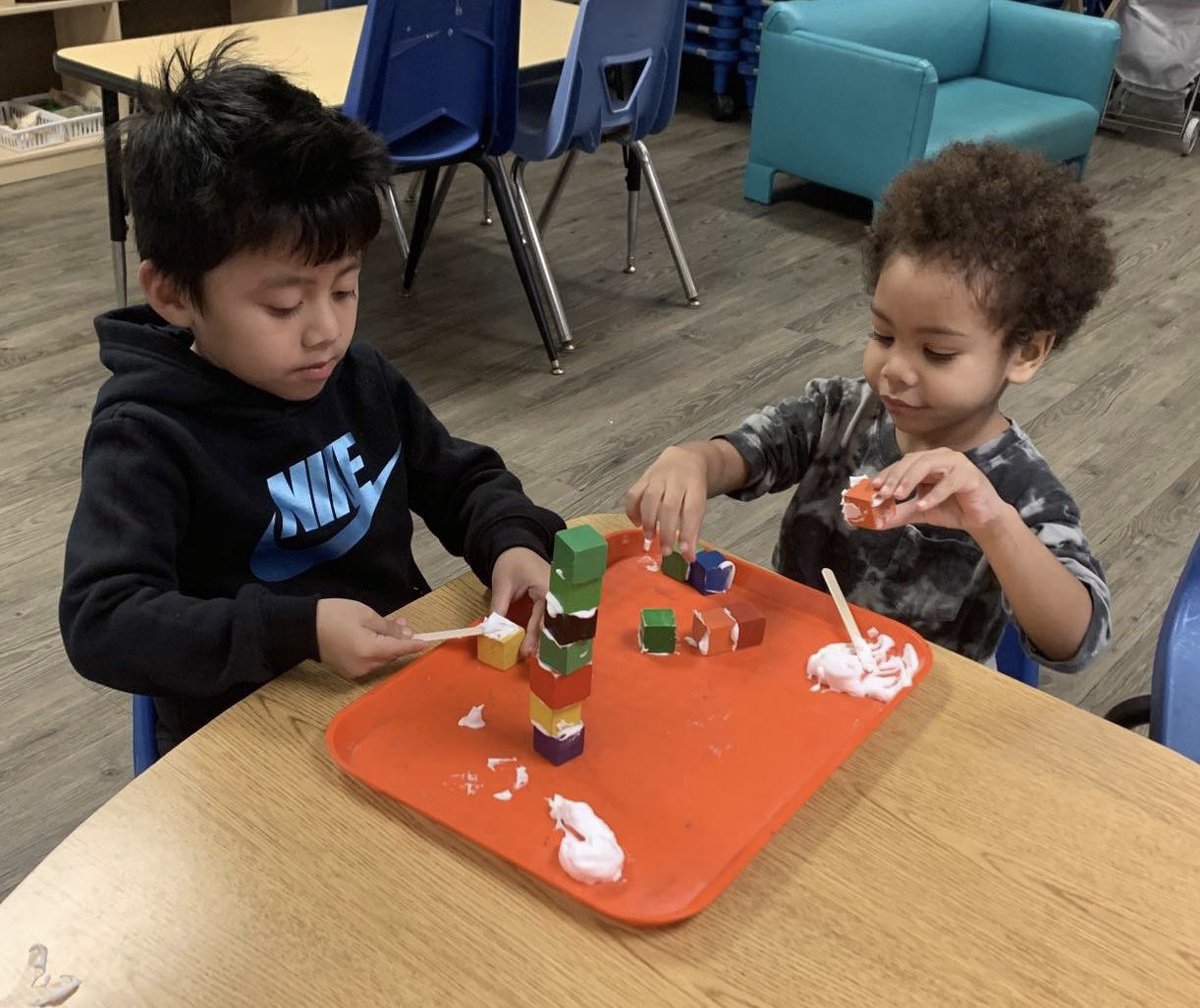PinewoodEEC's tweet photo. Pinewood EEC students deeply engaged with building towers using shaving cream as “cement”. They counted and compared their towers with their friends. Hands on, minds on. #Buildings #finemotor #spatialskills @ECED4LA @Kelly4LASchools @SteamLdne @MLB4PreK @DeanTagawa https://t.co/JEDEUKgW7R
