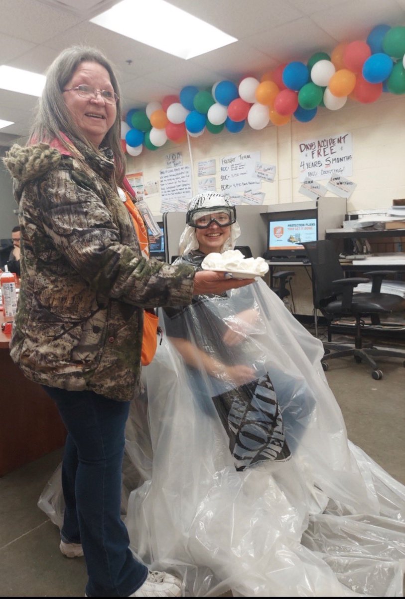 FES Morgan taking one for the team!  She challenged her team to make credit goal, and she would take some pies to the face!  Here is the end result!