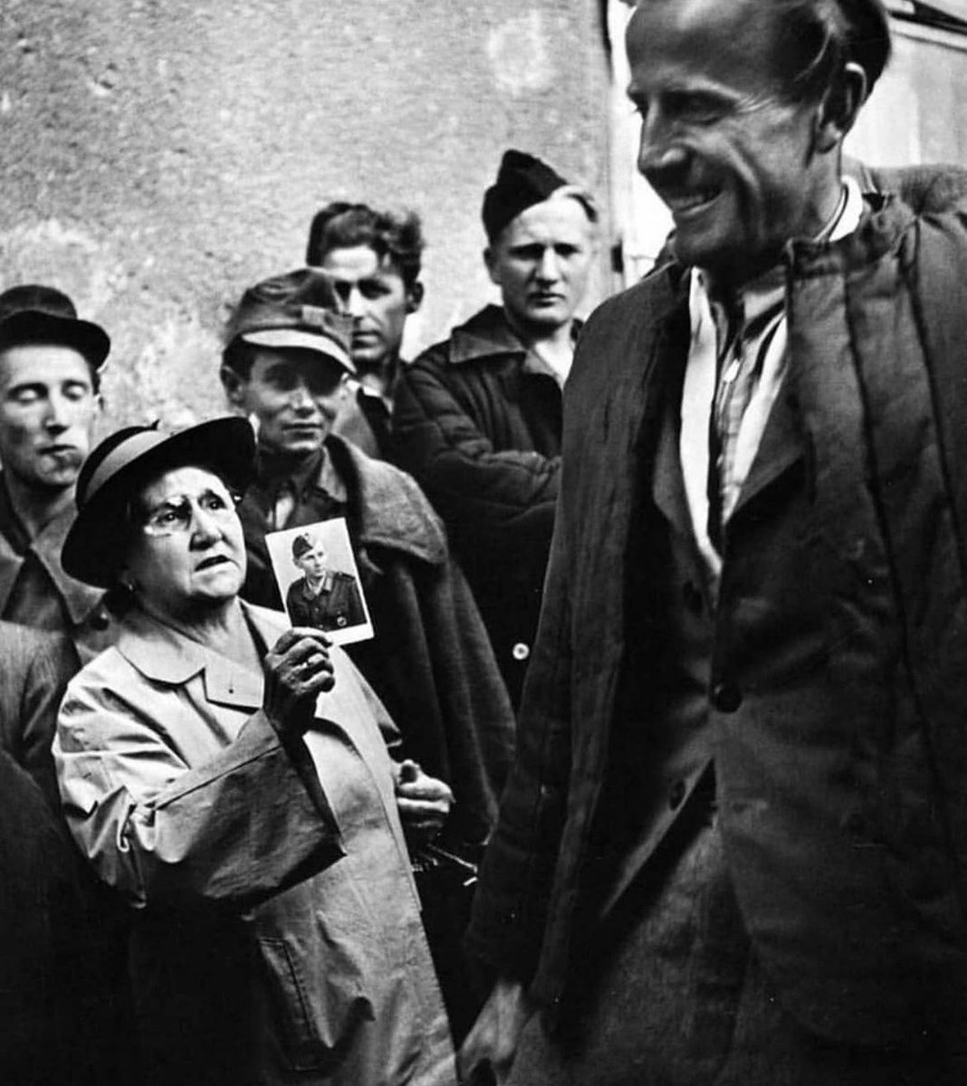 wars's tweet photo. A mother, in Vienna, holding a picture of her son up in mixture of hope and despair, 1947. https://t.co/hhRU1b8EN8