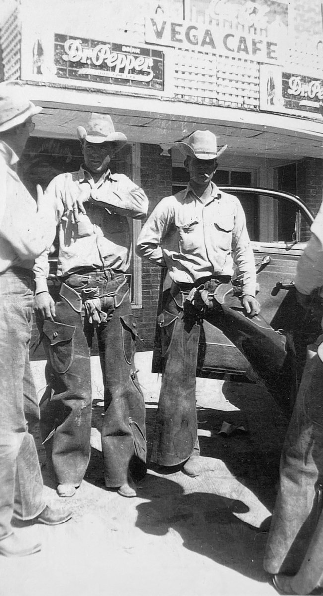 Traces reader Greg Conn shared this nifty shot of cowboys outside the Vega Cafe in Vega, Texas.  Three of the cowboys are Red Watkins, Cosey (Toots) Everett, and Bud Gualt but Greg wants to know if anybody recognizes the man 2nd from left, reaching into his shirt pocket. GREAT!