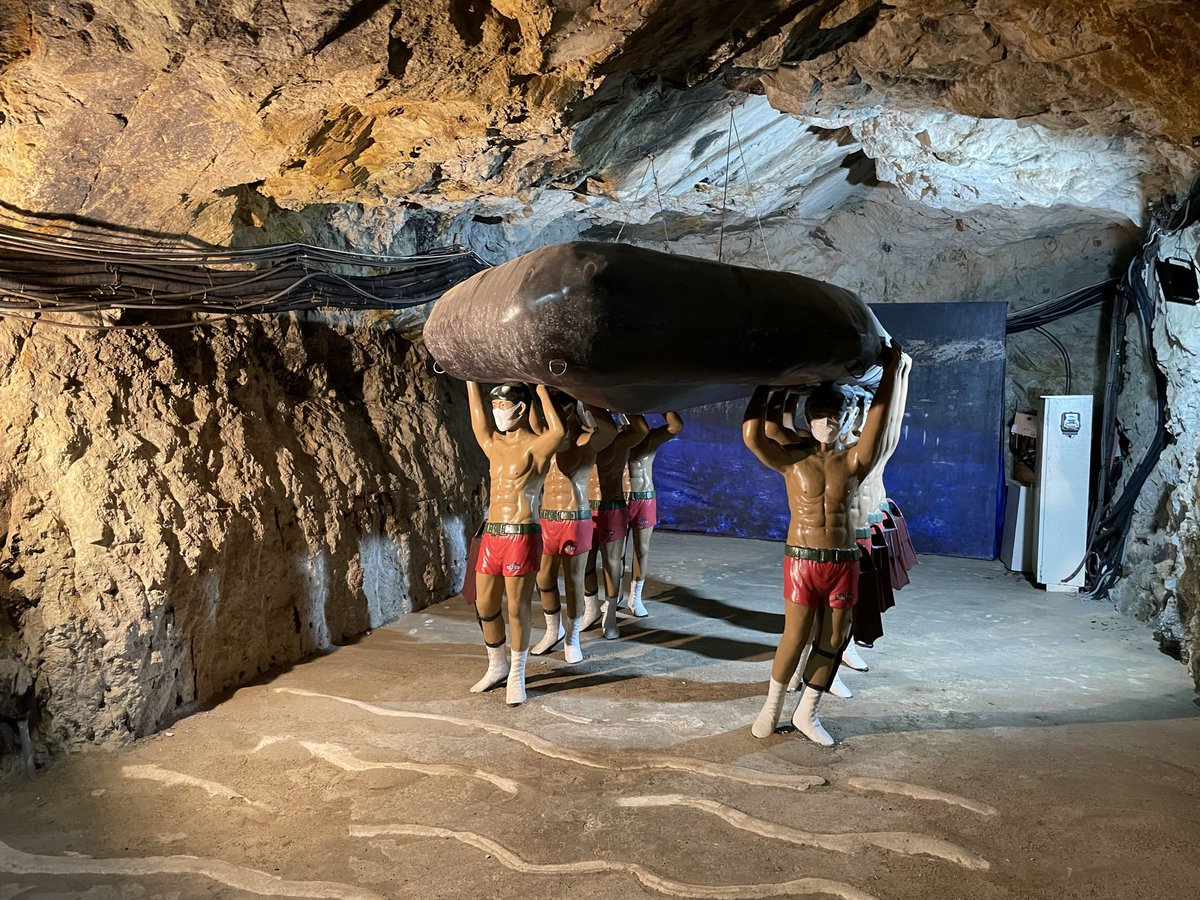 PieraChen's tweet photo. Military tourism in Taiwan: a former defensive tunnel is being used for boat-rides. The mannequins are supposed to represent the soldiers who built the 700m-long tunnel during the Cold War. Whoever designed their look must have taken inspiration from Ken and Barbie. https://t.co/pY7NSetLtl