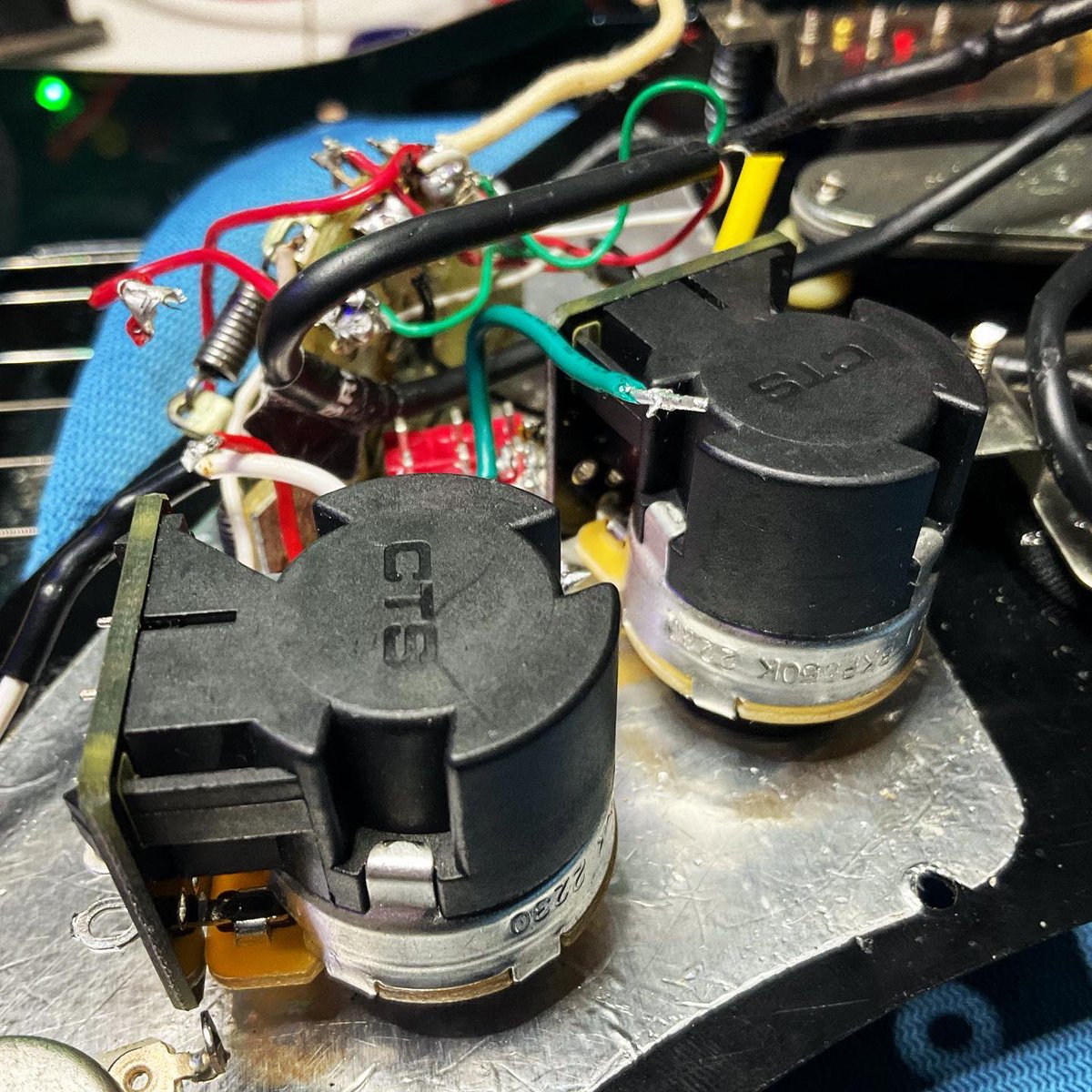 A Bare Knuckle pickup install on a #Musicman in for extensive mods. I’m also adding two Push/Pull controls that change the sound of the blue/black pickups 🥶🔥 #bareknucklepickups #guitarpickups #guitarrepairs