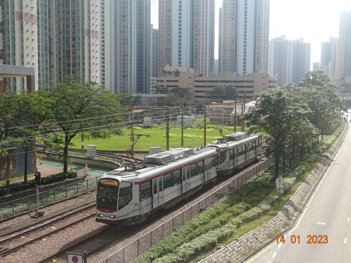 Phase I tramcars 1043 &amp; 1060 are departing Tin Yat as they head north on route 706.