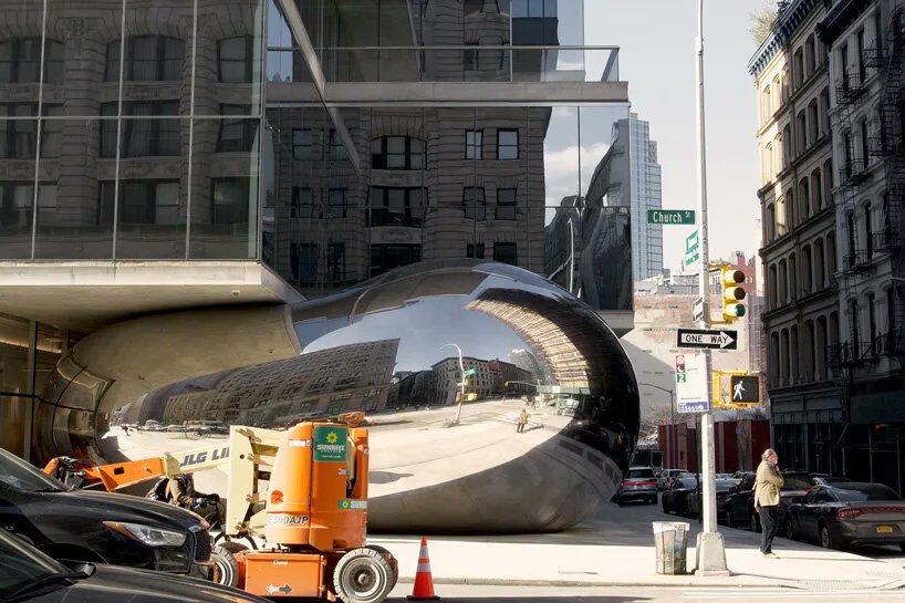 designboom's tweet photo. anish kapoor's newly completed 'bean' is snugly squeezed beneath the cantilevering slabs of the 'jenga building' at 56 leonard street in new york city. https://t.co/BSPdDkv2Ur https://t.co/m5UR9wGWcV