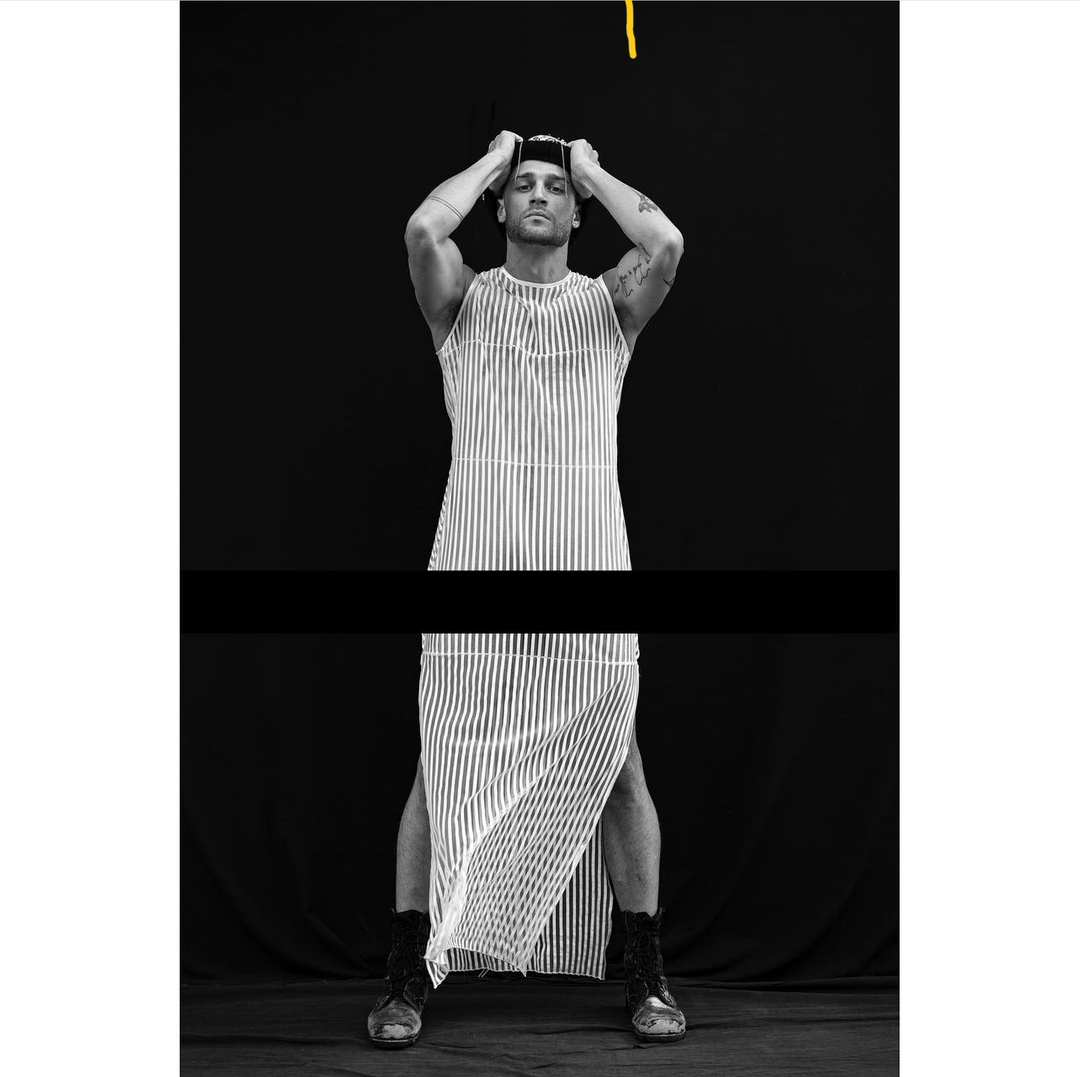 Dream high until you hit the Skyline. #LLESSURNYC 
.
.
.
📸 @swatters 
.
.
#B&Wphoto
#NonbinaryFashion
#MuscularMan
#PencilStripeDress
#SeeThroughStyle
#EditorialPhotography
#BlackAndWhiteEditorial
#FashionForward
#GenderlessFashion
#VerticalStripes
#OpticWhite
#MaleModel
#Fash