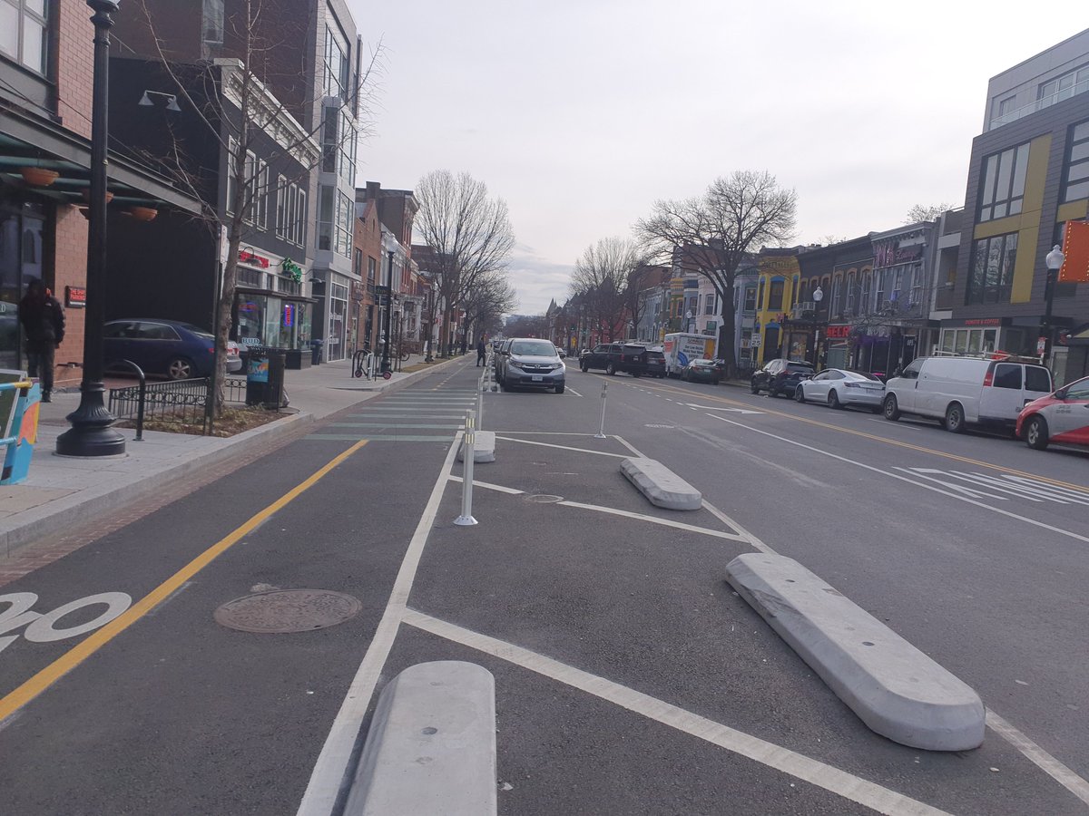 EyalDL's tweet photo. Second, the 9th street NW protected lanes south of U street. Clear signaling, striping and concrete barriers made for a much more pleasant experience than riding on 9th st pre bike lanes. Verdict: 🔥 https://t.co/9TM9n3AFL2