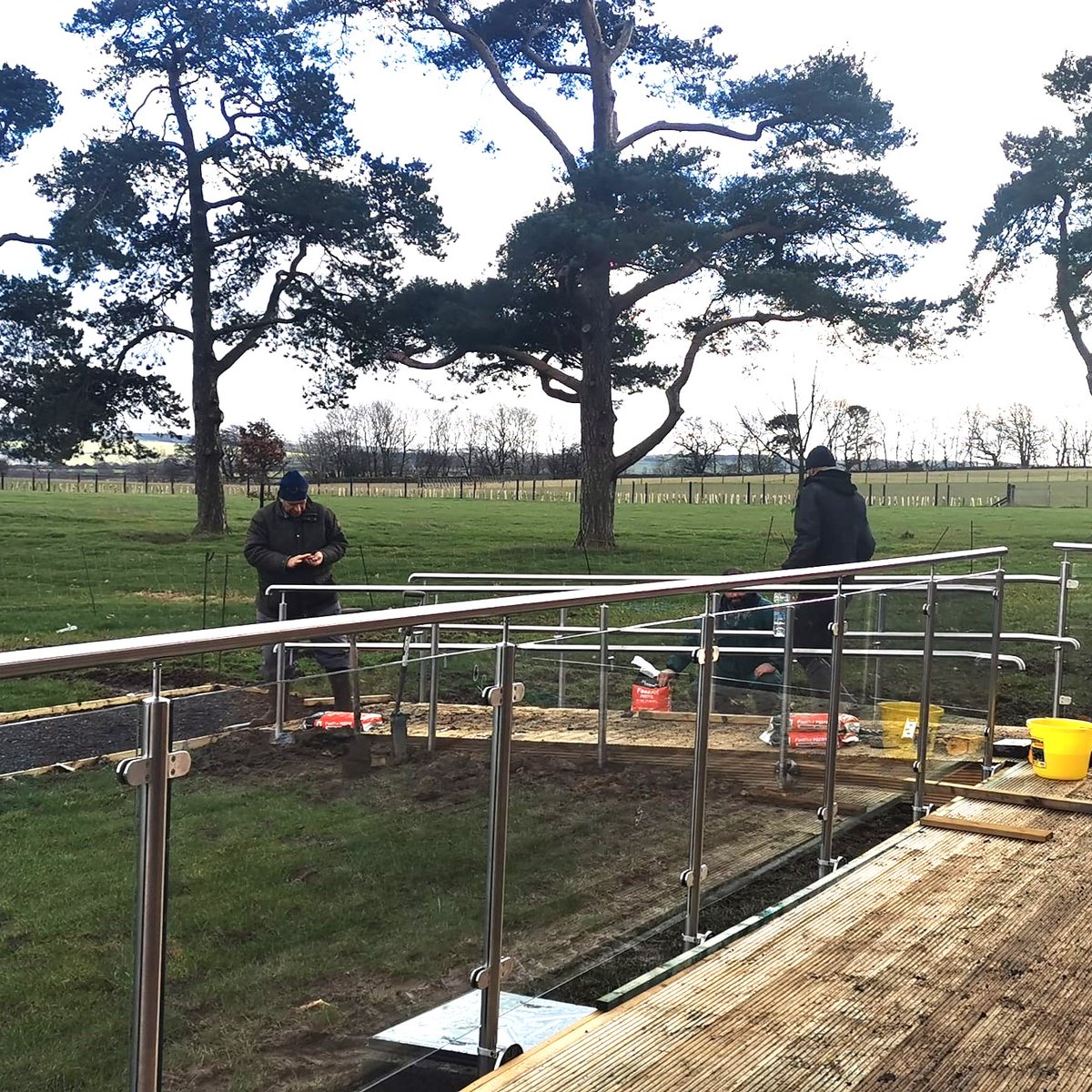 HaystaxFarm's tweet photo. A huge thank you to Ian, Rob and Craig who have worked so hard over the last few weeks fitting the glass balustrades to the lodges and coffee shop.  They are stunning.  I for one can't wait to sit and have a cup of coffee on the deck soaking in the view. https://t.co/VJ3yhFgyQE