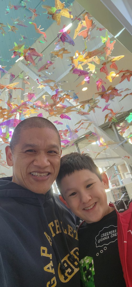 darrenclyn's tweet photo. Logan explored the brand new #aliefcommunitycenter and #houstonpubliclibrary 📚 The artwork behind us are #butterflies made out of #shoe brands. Look closely! It's pretty cool! Enjoy the day! #YAY @yaystack 🦋👟 https://t.co/LuYFYPzMxW