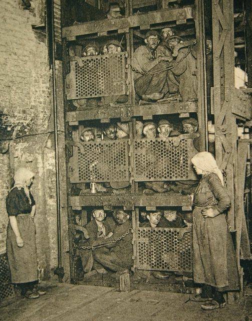 Coal Miners coming up a Coal Mine Elevator after a day of work in 1920's Belgium