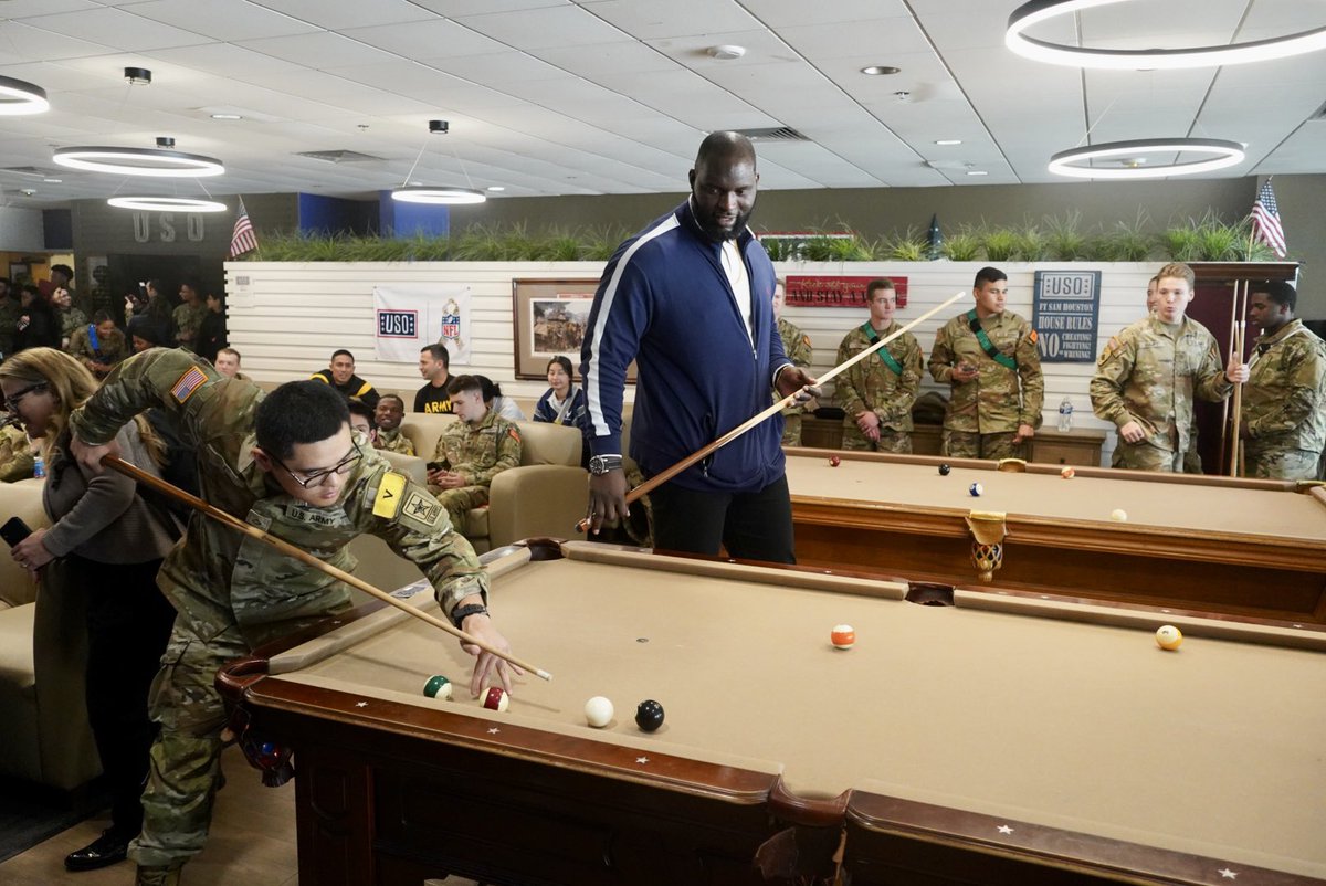 JBSA_Official's tweet photo. As part of their visit to JBSA-FSH, @WWE superstars had the chance to see just what makes @The_USO a special place!

The superstars Omos and Baron Corbin were able to see for themselves, getting a quick game of pool in with some trainees. https://t.co/hqo3xroIZ1