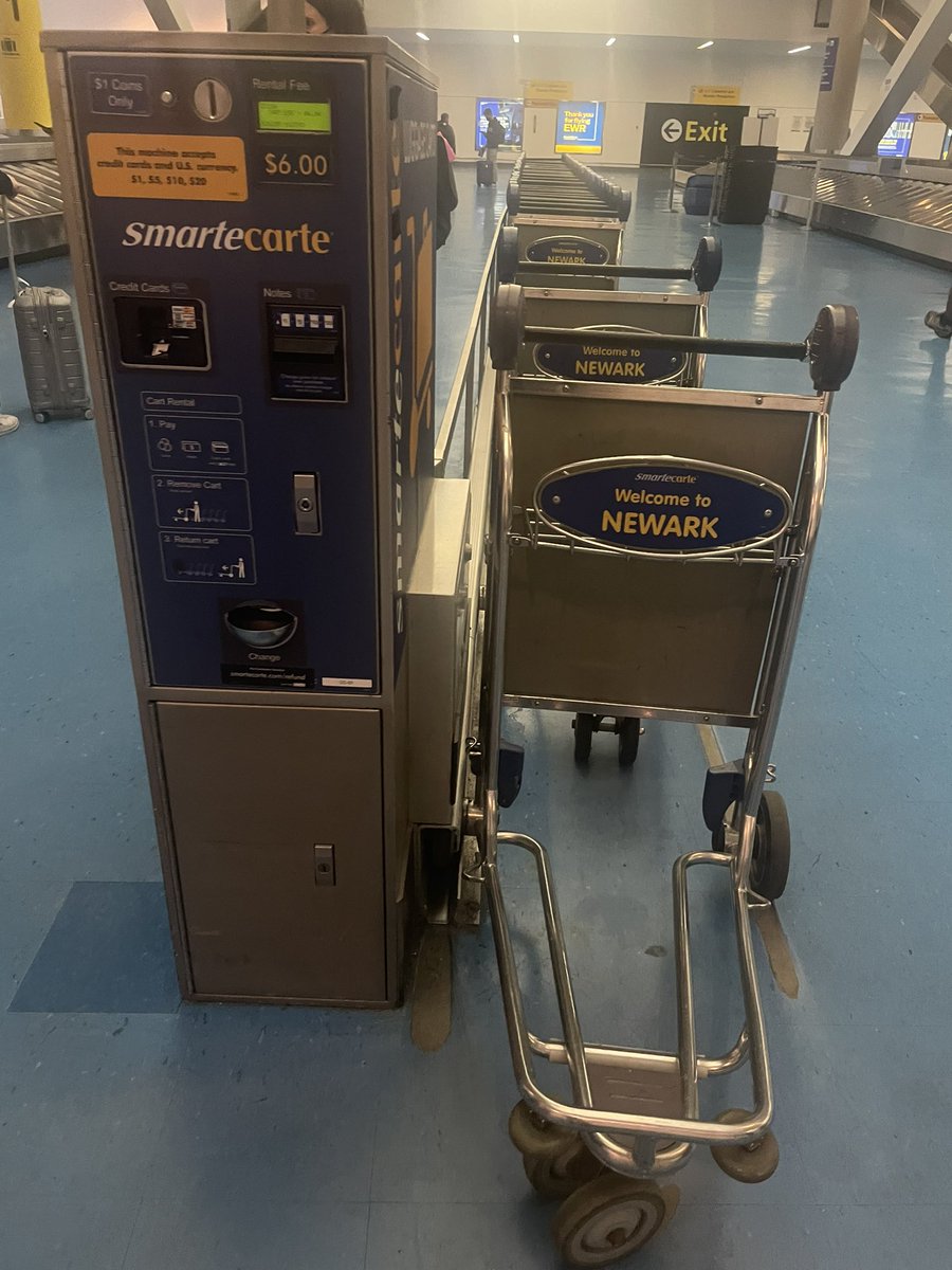 Can you name one other country that charges for carts at the airport?