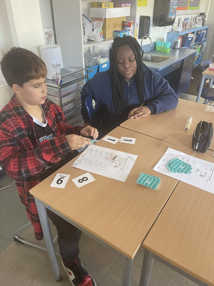 MsMcArthur_MPMS's tweet photo. Tell me you’re having fun in math, without really telling me. 
New workplace game for comparing decimals. I lost, of course, but did I really if laughter and excitement were in the air while learning math? 🤔 @HESSPLASH https://t.co/wmkbe77F4H