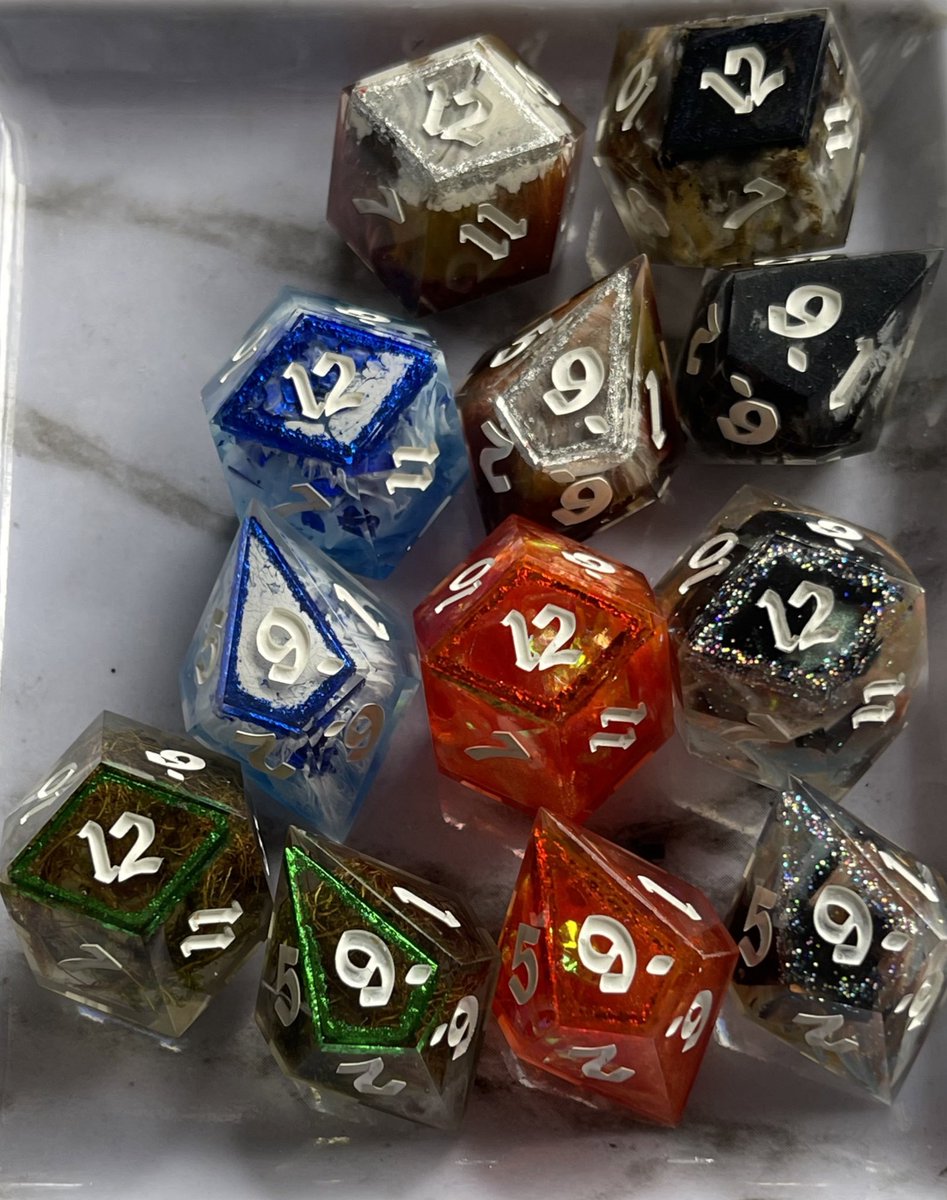ArtysCrafts's tweet photo. I was commissioned to make 6 pairs of dice, one for each type of land in Magic the Gathering.

This was such a fun project to work on and I am so grateful for the unique opportunity. https://t.co/l2E2TEt85A