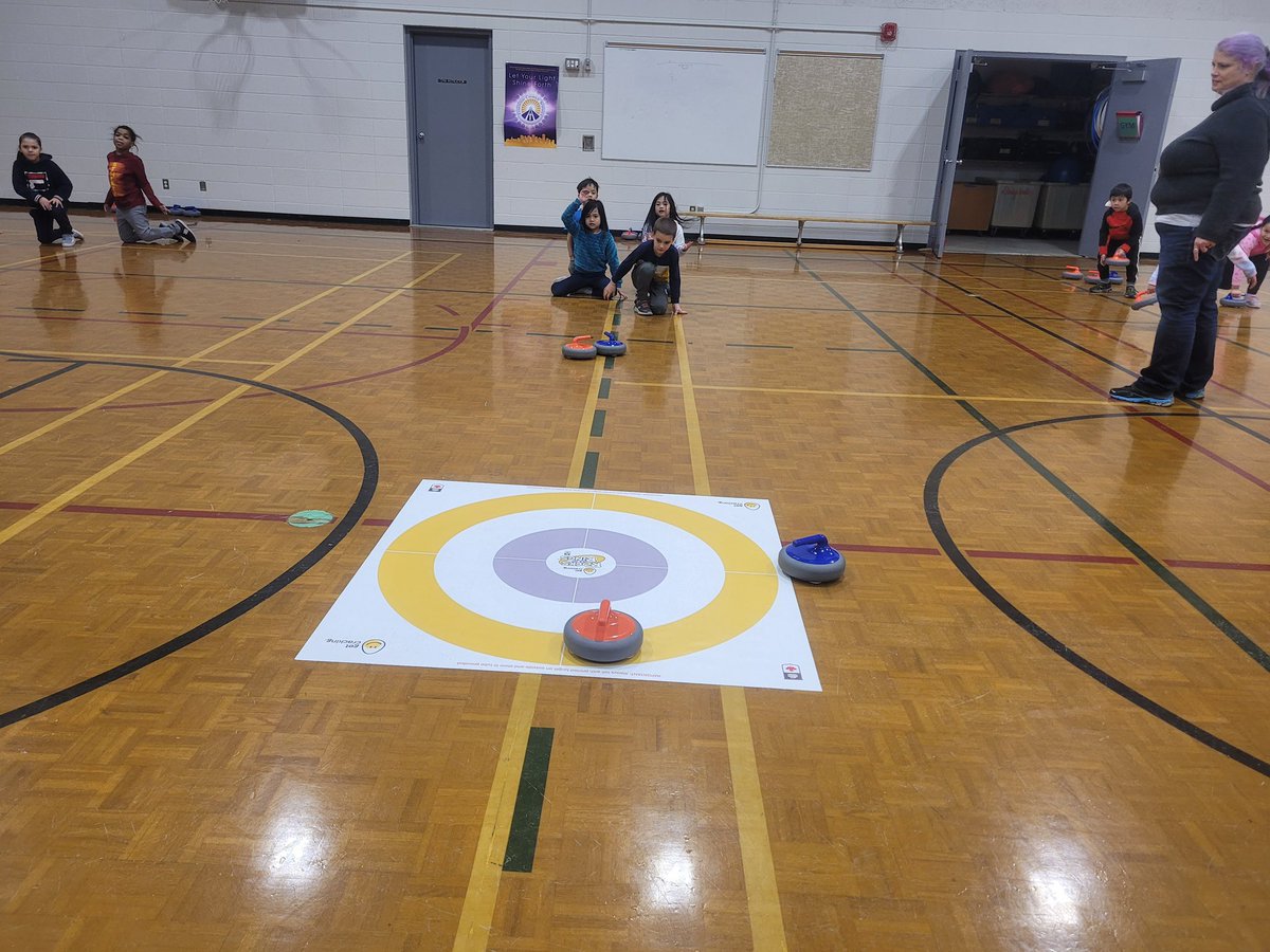 OLOPecsd's tweet photo. Mme Richer’s grade 1 students enjoyed learning about curling.  First we watched a video from CBC Olympics and learned vocabulary associated with curling. Next we went to the gym to practice.  So grateful to our school for giving students these opportunities.#ecsdfaithinspires https://t.co/O7qhi8vB5H