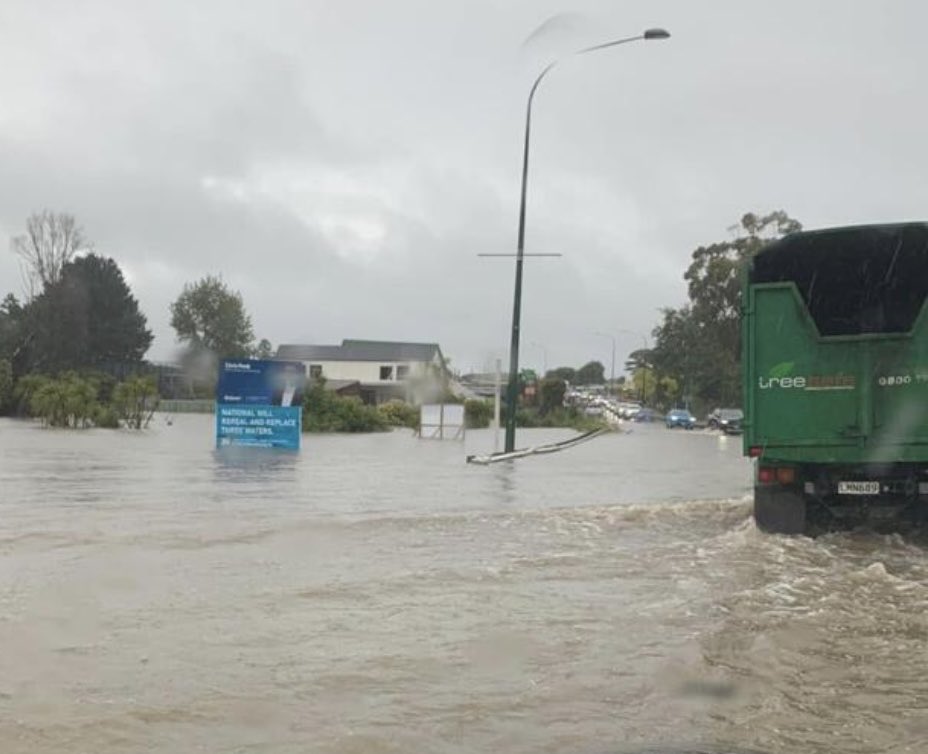 tmurphyNZ's tweet image. National Party Three Waters sign meets failed stormwater system, Kumeu, Jan 27.