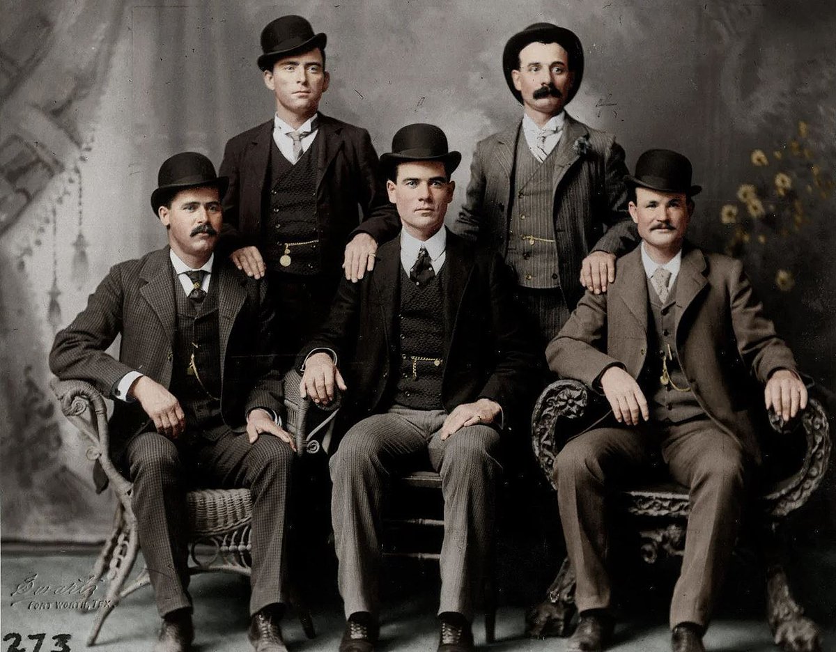 Colorized version of one of the most famous photos in Old West history: the Wild Bunch in Fort Worth. Sitting (L-R): Harry A. Longabaugh (The Sundance Kid), Ben Kilpatrick (The Tall Texan) &amp; Robert Leroy Parker (Butch Cassidy) Behind: Will Carver (News) &amp; Harvey Logan (Kid Curry)