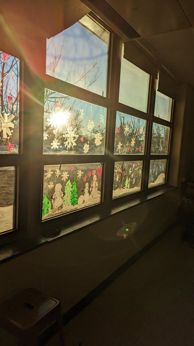 Room 255 was busy yesterday afternoon: new wintery window decor from Art Club and two new 'signs' from Walker and Flo!