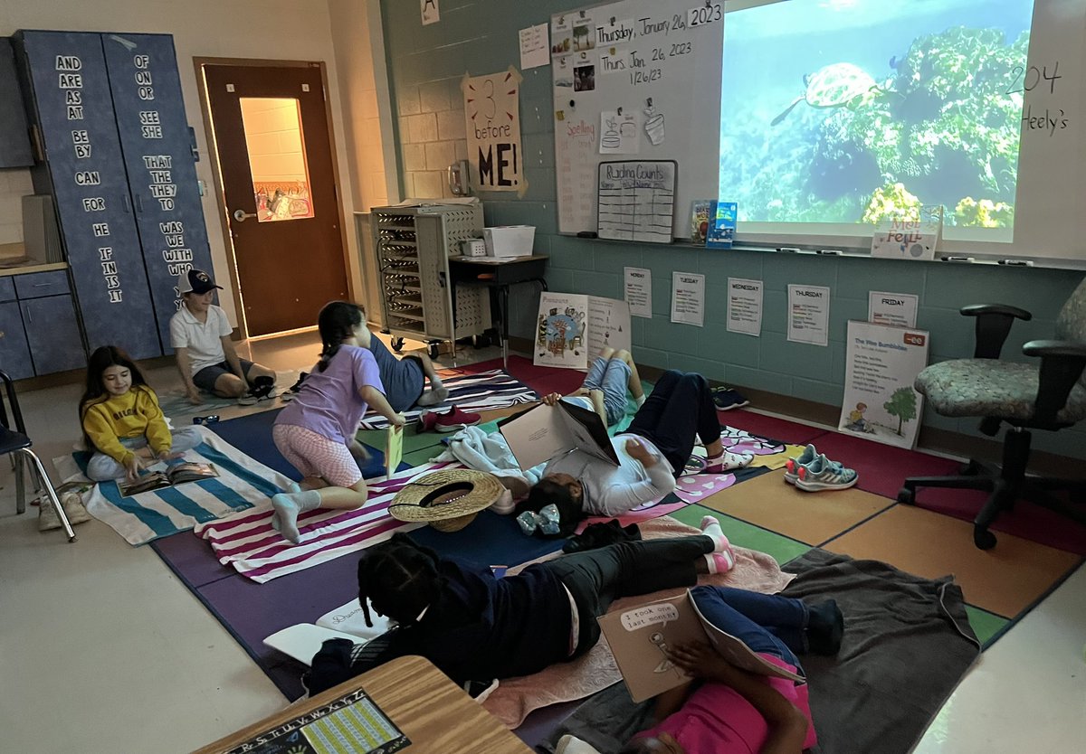 Reading with ocean friends while laying on their towels! #deepdiveintoliteracy @EESpanthers @TeachingFlorida @FloridaLiteracy