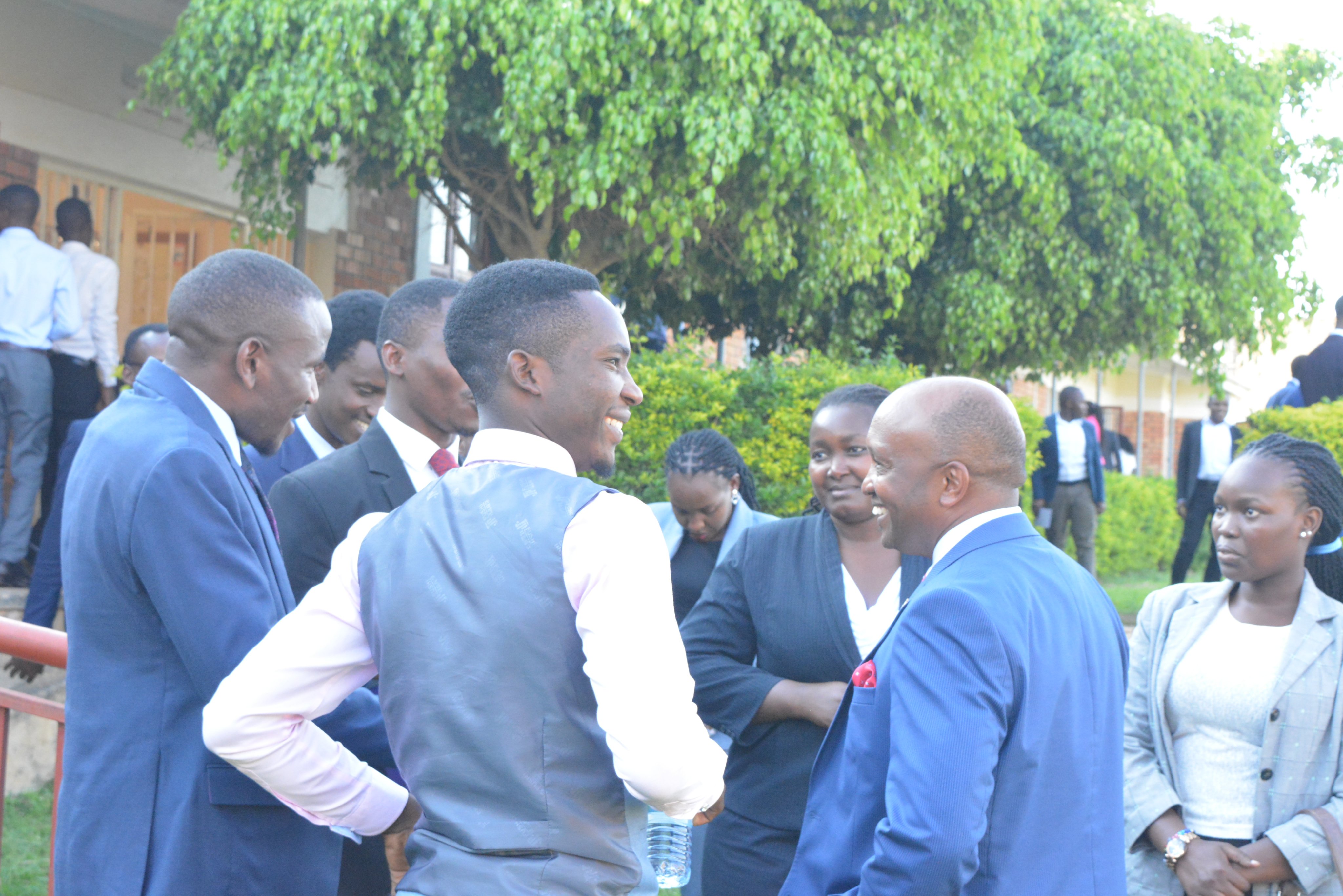 A section of Law students share a light moment with the Guest Speaker, Counsel Naboth immediately after the Symposium