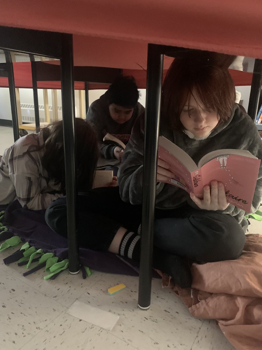 Reading and writing in our forts with our PJs during “No Lights Friday!”