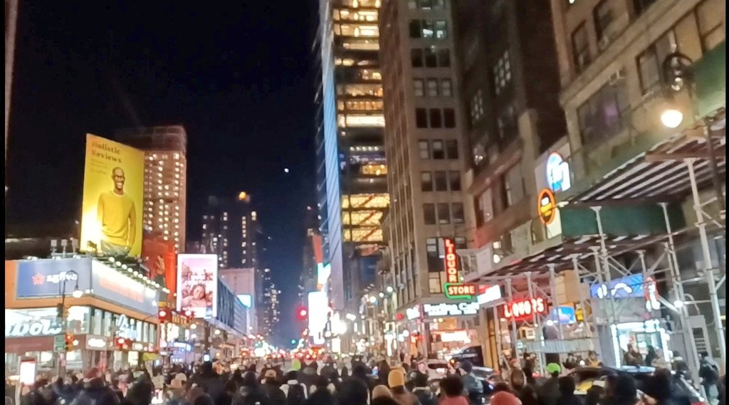 AshAgony's tweet image. Protesters in NYC marched from Union Square to Times Square tonite to demand justice for #TyreNichols (& all people killed by cops) & the abolition of police. Radical artwork went up. An NYPD car & Whole Foods got redecorated. NYPD followed the march & arrested at least 2 people.