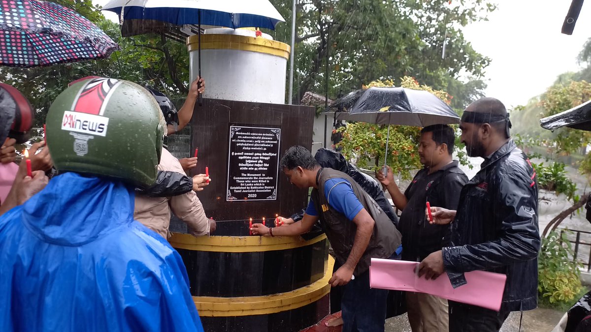 JDSLanka's tweet photo. Members of #Batticaloa #Tamil Journalists Union and civil society activists in the area, endured pouring rain to mark 'Black January' on Friday (27),  condemning crimes committed against journalists by #SriLanka's state over the past decades. https://t.co/1PFy33Rma3