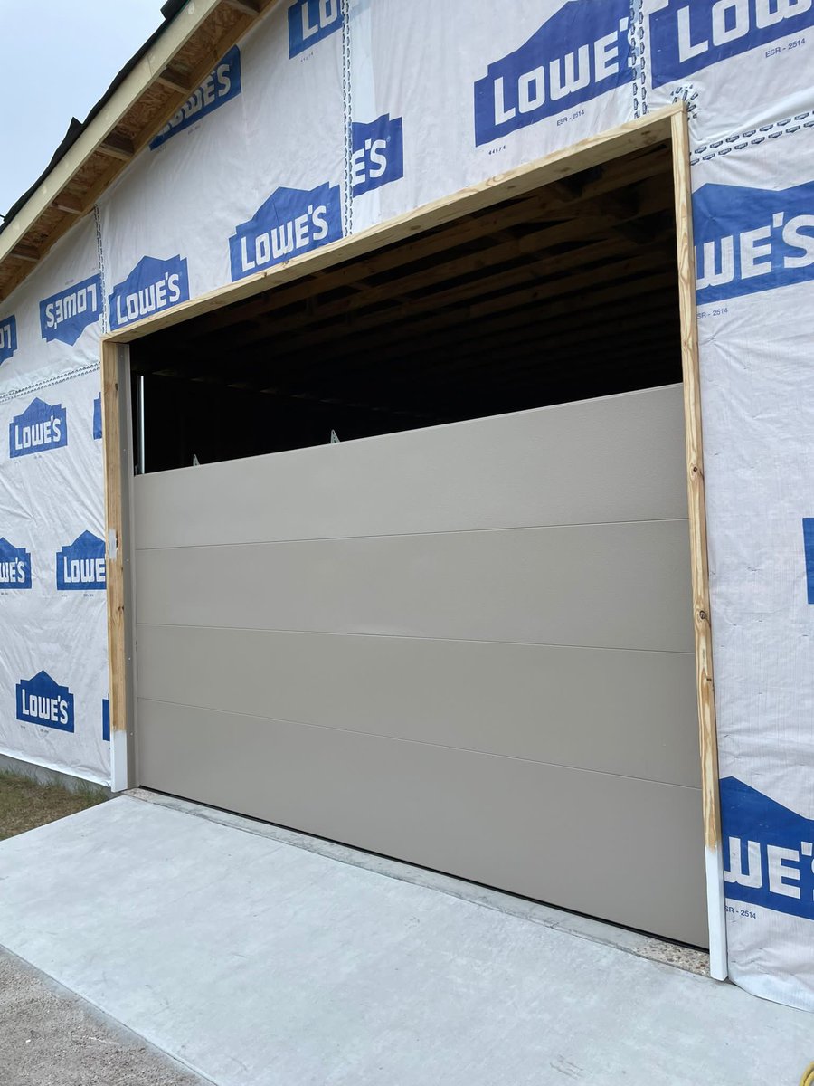 New Amarr Lincoln 1000 flush panel design installed bu Keep’em Rollin Garage Doors. Proudly serving San Antonio call us today for a free estimate. 210-382-2867