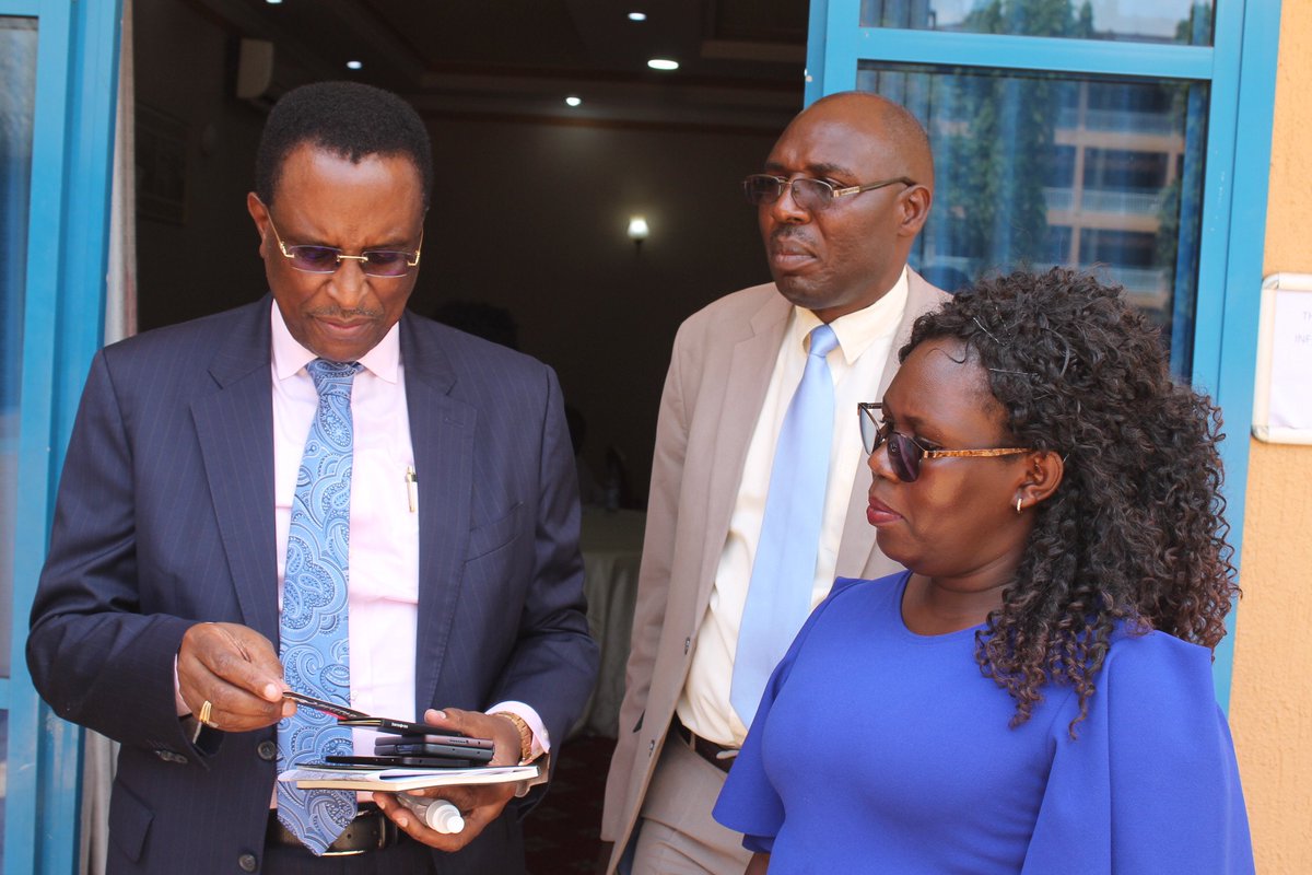 NilesetT's tweet photo. Commissioner Winston katushabe,Fabio's Patrick Kayemba and Scola share a moment after the Duologue at Africana Hotel https://t.co/nvA2z4lNd7
