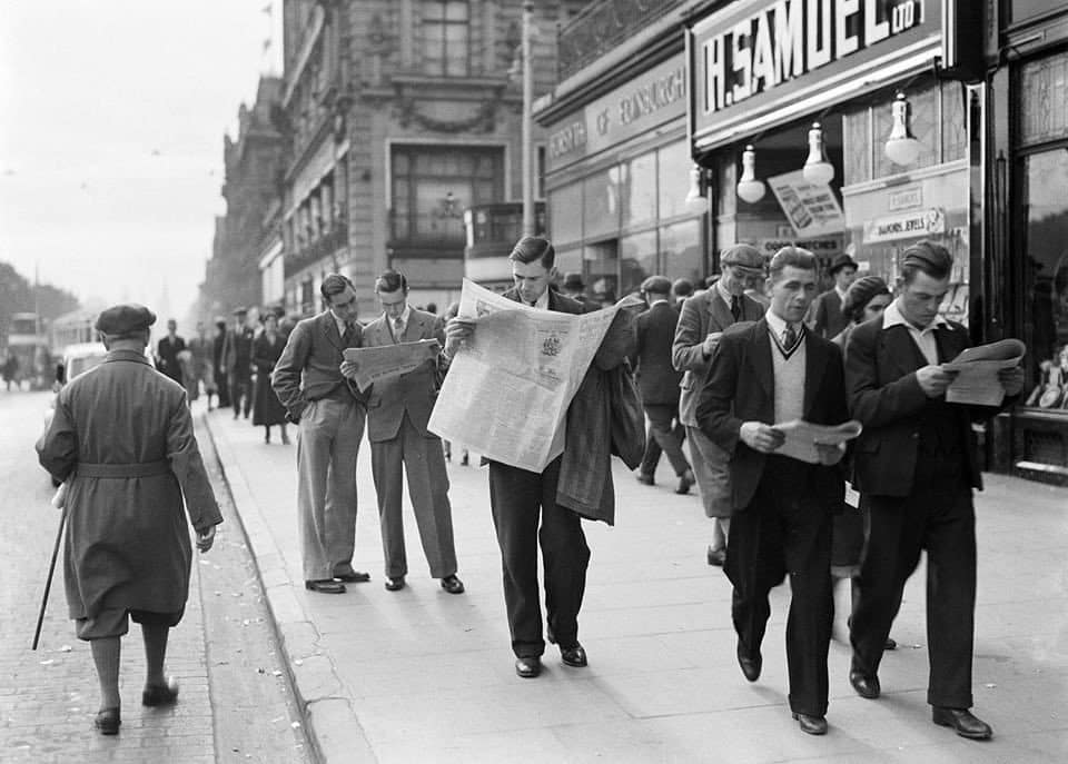 Kids nowadays, heads constantly in a phone screen, not looking where they're going. 
.
Princes Street, Edinburgh 1934.
Photo Willem van de Poll