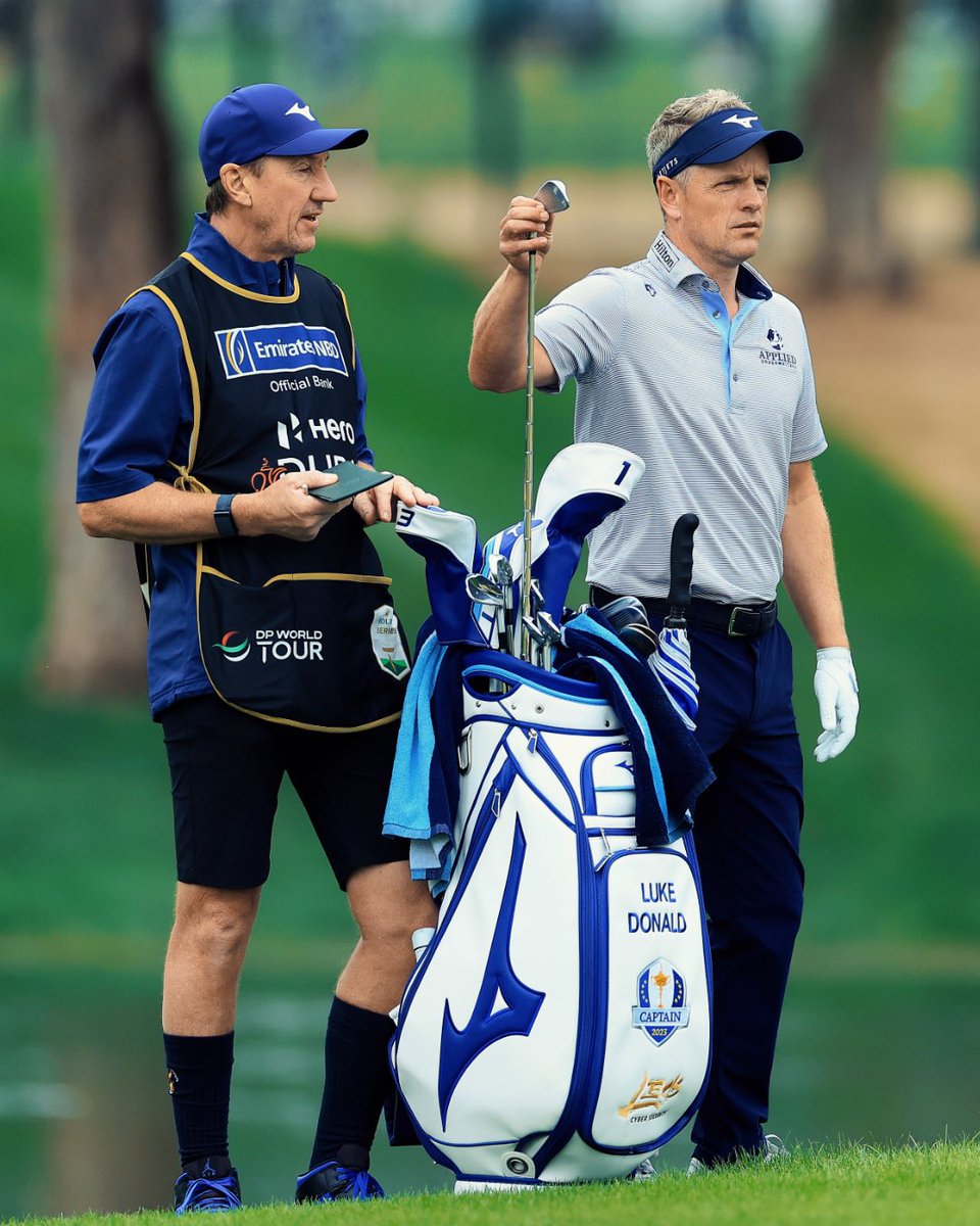 caddie_world's tweet photo. Afternoon scoreboard watching for @RyderCupEurope captain @LukeDonald and caddie John McLaren. Making the final 2 rounds @EmiratesGC on the mark. #johnnylongsocks #HeroDubaiDesertClassic https://t.co/ttyo0PG08a