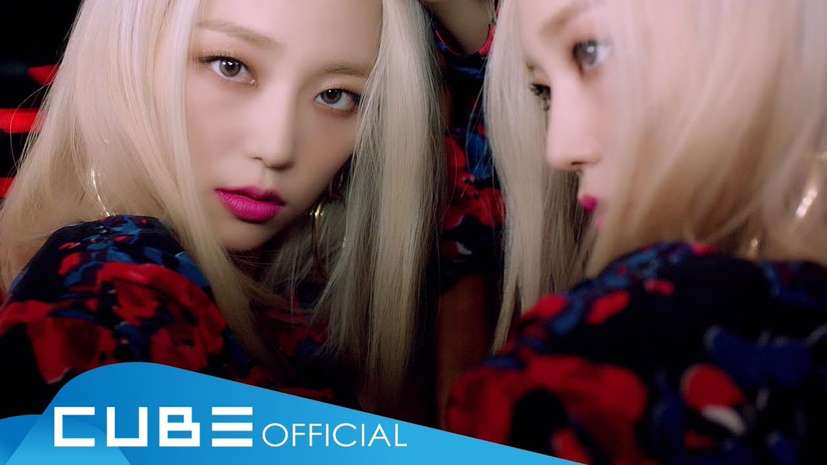 A woman with blonde hair and pink lipstick poses against a backdrop featuring her own reflection, wearing a dark floral outfit. The "CUBE OFFICIAL" logo appears in the bottom left corner, with the post suggesting this image relates to CLC, a K-pop group under Cube Entertainment, and a message released on January 30, 2019.
