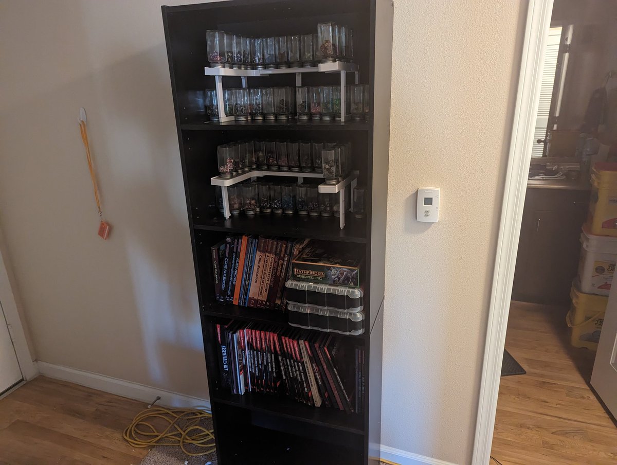 Behold, depression bookcase #2! (Merlin loves hanging out in the bottom shelf, so I might just figure out how to make that into a cat cave.)