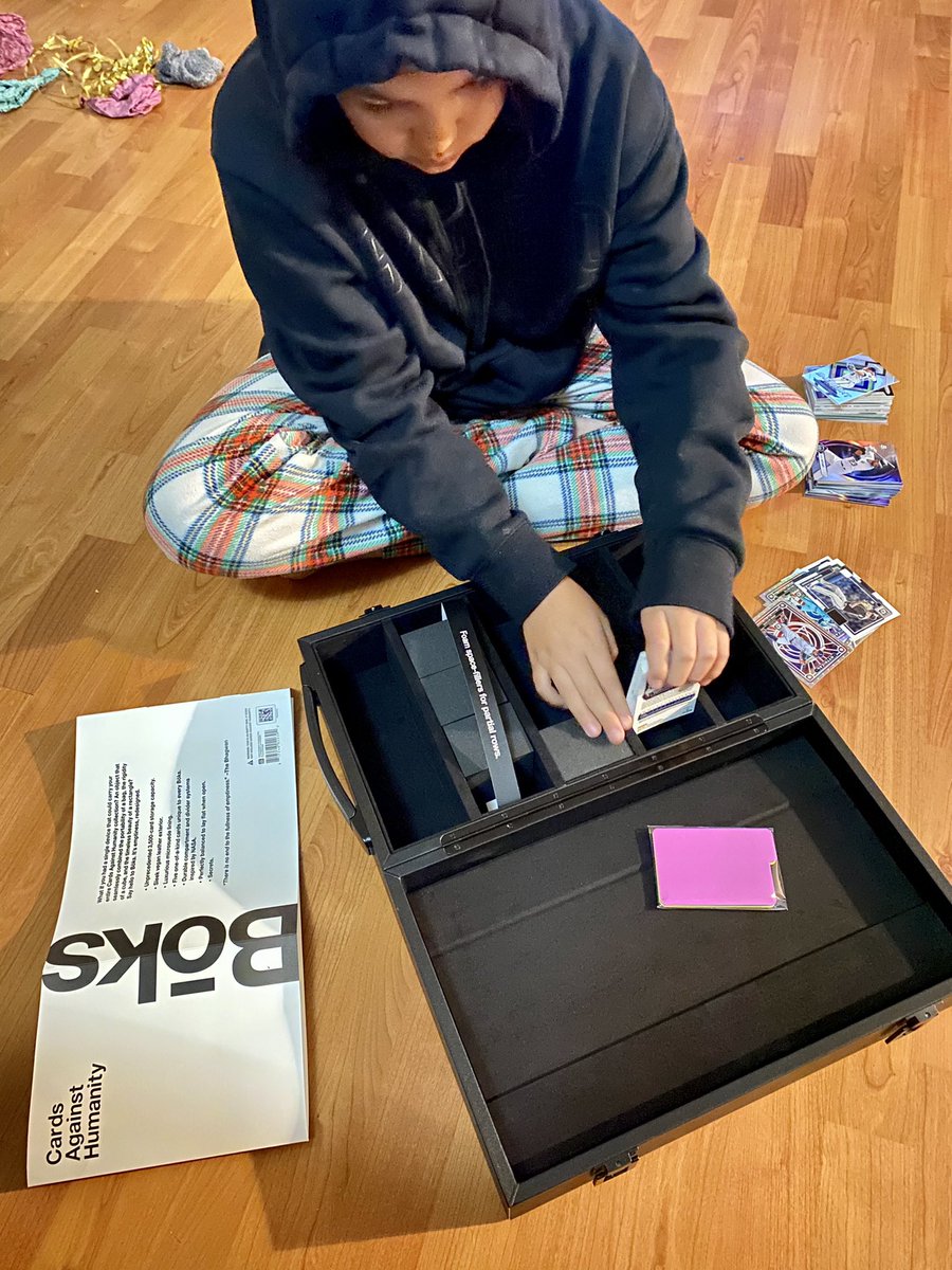 Finally got my Black Friday promo #Boks and it was promptly stolen and repurposed as a baseball card holder by this one. Thanks <a href="/CAH/">Cards Against Humanity</a>, guess I’ll have to buy a few more. 😂