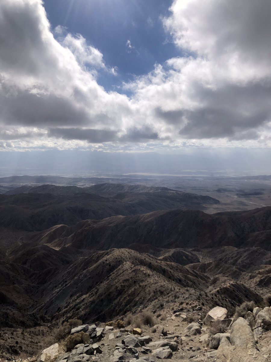 ZacharyObama's tweet photo. I hope everyone had a great Sunday! Pretty blustery day out in #JoshuaTree but hardly a sprinkle in those clouds, we’ll see about tomorrow. There is no sign at Keys View for Inspiration Peak and the colors at Split Rock were thankfully on point. #JTree #Photography #Desert 🏜️💨📸 https://t.co/gt2NiO7Eh9