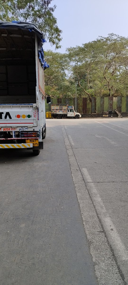 iamsachinchand's tweet photo. These trucks are daily parked at Ramgadh bus stop in lokhandwala kandivali east which may lead to accident for non visibility of vehicle coming from other side traffic police plz look into it and clear these vehicle from this place 
@MumbaiPolice @MumbaiRTO @CPMumbaiPolice https://t.co/PYjQE7UFvT